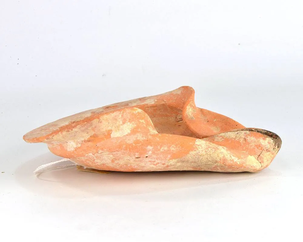 A large terracotta Shell-type Oil Lamp, Persian Period, ca. 500 BCE